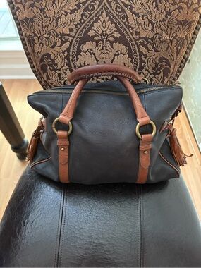 Women’s Leather Satchel Bag in black with Tan Trim. 11 inch long 15 wide.